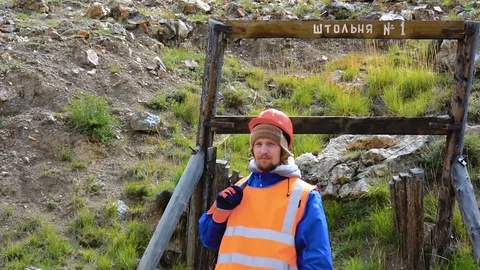 Mining engineer, a geologist in the protective reflective vest, gloves and Stock Footage 81485082