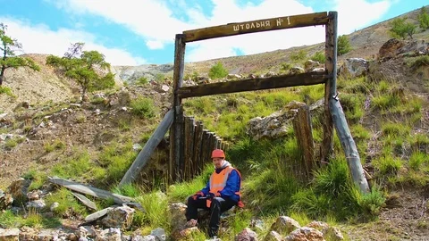 Mining engineer, a geologist in the protective reflective vest, gloves and Stock Footage 82283348