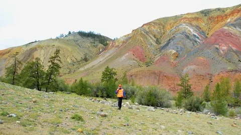 Mining engineer, a geologist in the protective reflective vest, gloves and Stock Footage 83489636