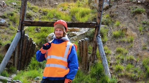 Mining engineer, a geologist in the protective reflective vest, gloves and Stock Footage 83497915
