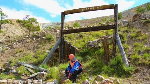 Mining engineer, a geologist in the protective reflective vest, gloves and Stock Footage 83501385