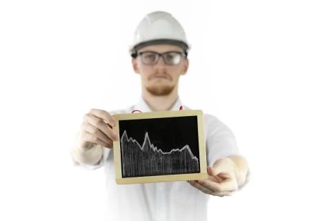 Mining engineer holding tablet with falling graph sadly looks at camera Stock Photos