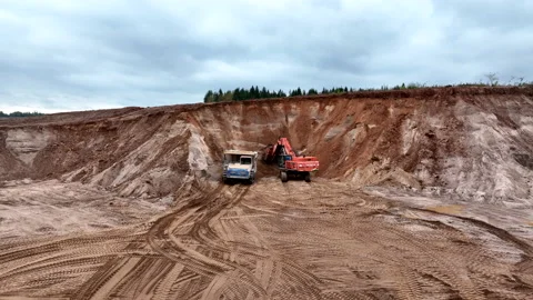 Mining Excavator Hitachi load sand in Belaz mining truck. 動画素材 219721821
