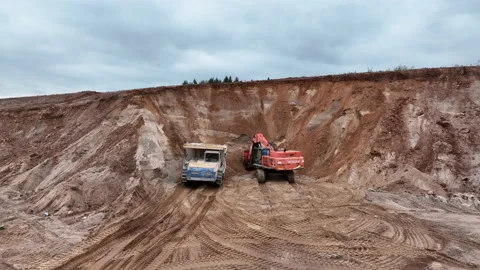 Mining Excavator Hitachi load sand in Belaz mining truck. 動画素材 219721906