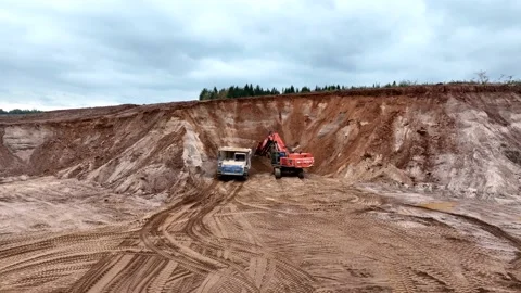Mining Excavator Hitachi load sand in Belaz mining truck. Video stock 219725425