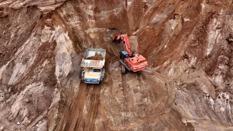 Mining Excavator Hitachi load sand in Belaz mining truck. Stock-Footage 219725476