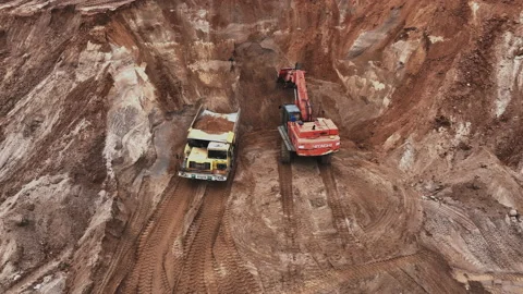 Mining Excavator Hitachi load sand in Belaz mining truckin in open-pit Stock-Footage 219733092