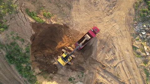Mining excavator load the sand into dump truck in open pit. Stockbeeldmateriaal 161416881