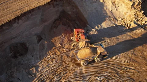 Mining excavator load the sand into dump truck in open pit. Stock-Footage 167044217
