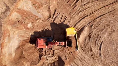 Mining excavator loads sand into mining truck. Excavator loads sand Stock Footage 195802387