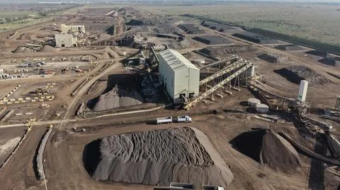 Mining facility processing raw materials with heavy equipment Stock Photos