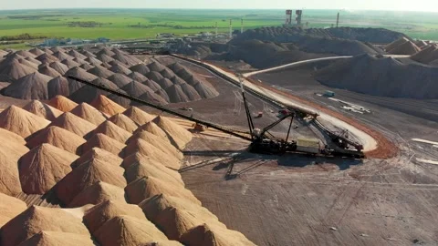 Mining industry close up. Telestacker handles the ore for potash waste heaps Stock Footage 170550700