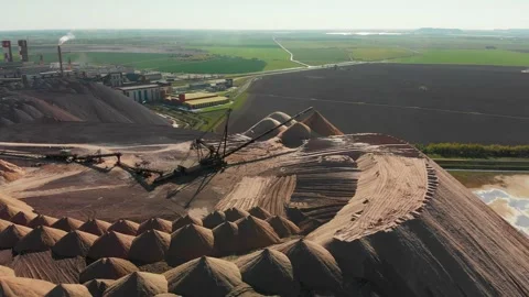 Mining industry close up. Telestacker handles the ore for potash waste heaps Stock Footage 170551684