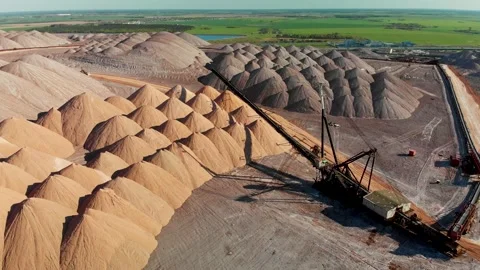 Mining industry close up. Telestacker handles the ore for potash waste heaps Stock Footage 170551698