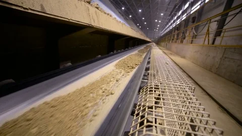 Mining industry. Ore moving on conveyor belt in modern processing plant. Slider Stock-Footage 74785212