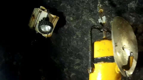 Mining ligts view from electric to carbide, kerosene and simple candlelight Stock Footage 93595532