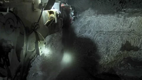 A mining machine cuts rock in a mine shaft Stock Footage 279465643