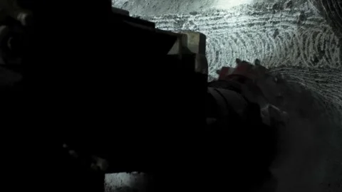 A mining machine cuts rock in a mine shaft Stock Footage 279465702