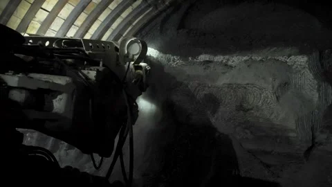 A mining machine cuts rock in a mine shaft Stock Footage 279465723
