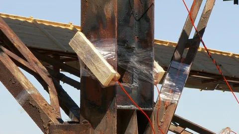 Mining of a metal structure with a red dynamite block TNT. Blasting Specialists. Stock Footage 129966591