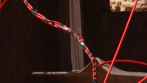 Mining of a metal structure with a red dynamite block TNT. Blasting Specialists. Stock Footage 138217354