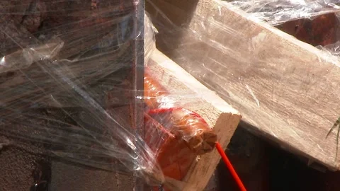 Mining of a metal structure with a red dynamite block TNT. Blasting Specialists. Stock Footage 138217425