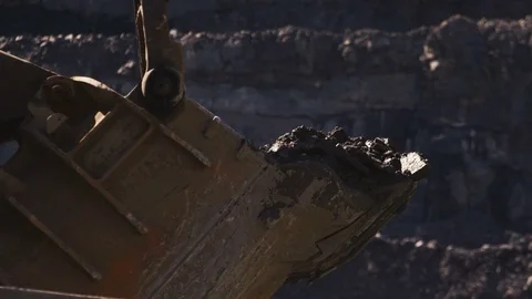 The mining of minerals in a pit, dropping soil into the truck Stock Footage 72804242