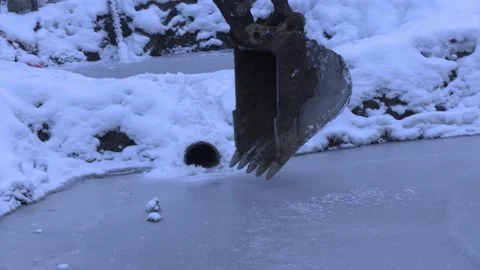 Mining Operation Excavator Bucket Breaking Ice Stock Footage 154135918