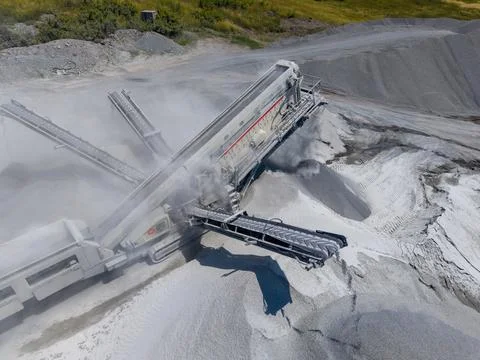Mining operation extracts minerals from a quarry in the afternoon light Stock Photos