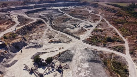 Mining operation in a large quarry with heavy machinery at work Stock Footage 344539478