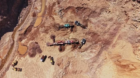 Mining operation in rocky terrain using heavy machinery and equipment Stock Footage 338240701