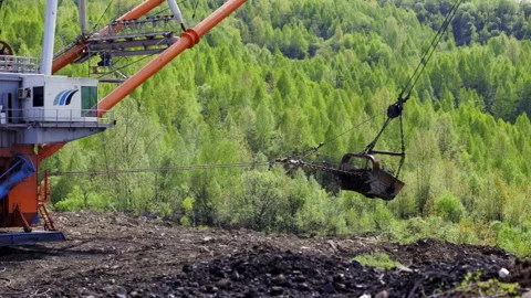 Mining Operations being conducted within a lush green environment, where nature Stock Footage 283260550