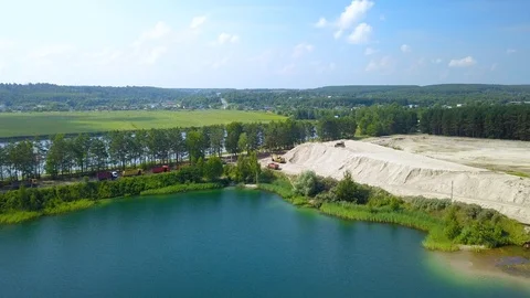 Mining operations for sand extraction at sandy quarry, aerial shot Stock Footage 97637690