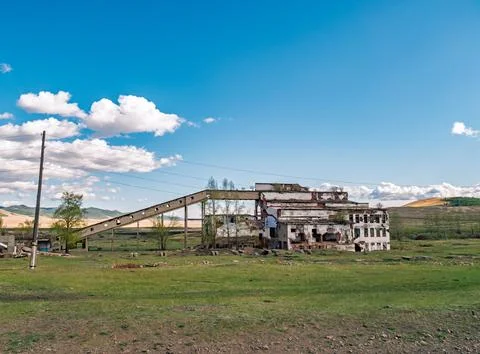 Mining plant structure with conveyor and open landscape in rural area during  Stock Photos