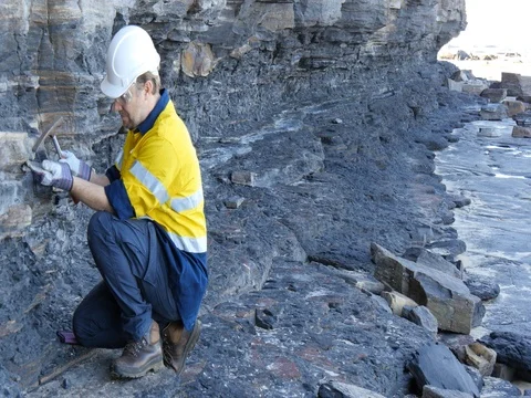 Mining prospect mineral exploration Geologist taking field rock data sample Video stock 78587454