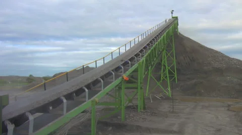 Mining stockpile fed by conveyor Stock Footage 49044588