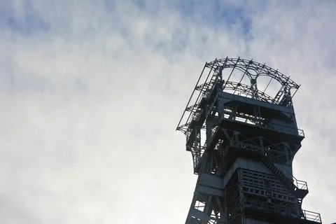 Mining tower in front of a white sky Stock Photos