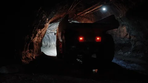 Mining truck moves inside dark tunnel in copper pyrite mine Stock Footage 116498709