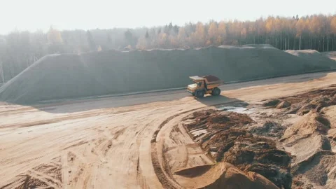 Mining truck transporting sand at sand quarry. Aerial view of mining machinery 스톡 동영상 237266041