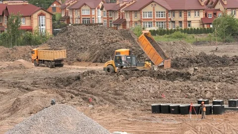 Mining trucks working on a construction site Stock Footage 77633340