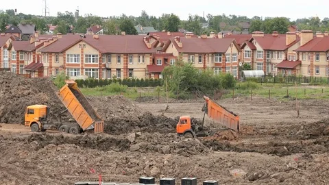 Mining trucks working on a construction site Stock-Footage 78319830