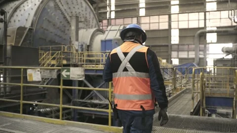 Mining Worker Approaching Operating SAG Mill at El Teniente Plant Stock Footage 339378801