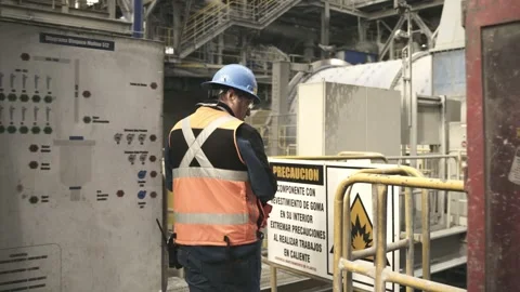 Mining Worker Passing Safety Warning Signs Inside Copper Processing Plant Stock Footage 339378804