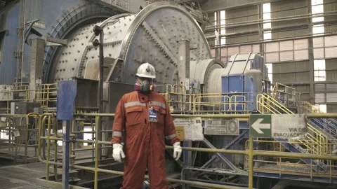Mining Worker Standing Near Large Grinding Mill at El Teniente Copper Mine Stock Footage 339378216