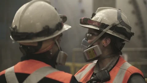 Mining Workers Communicating Near SAG Mill at El Teniente Copper Mine Stock Footage 339378248