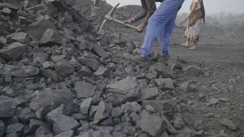 Mining workers extracting coal using hand tools at coal mine Stock Footage 318276559