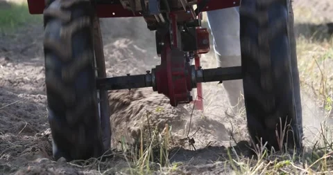 Minitractor tillerblock plows the ground. Stock Footage 220729463