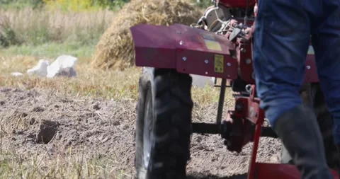 Minitractor tillerblock plows the ground. Stock Footage 220729464