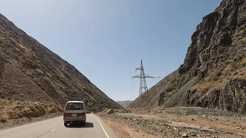 A minivan driving along a beautiful mountain road Stock-Footage 241381534