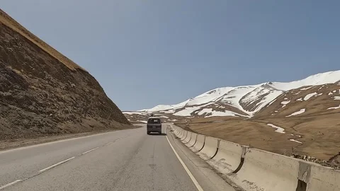 The minivan is driving through a beautiful mountain valley Stock-Footage 241381596